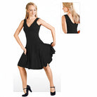 DanzaShop red sleeveless dance dress with wide straps, V-neck, and flared skirt with ruffled hem. Model shown in motion.
