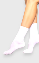 DanzaShop white microfiber dance socks made of polyamide and elastane. Available in kids and adult sizes.